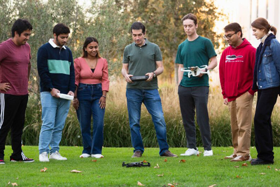 Gustavo Vejarano showing drone to LMU students
